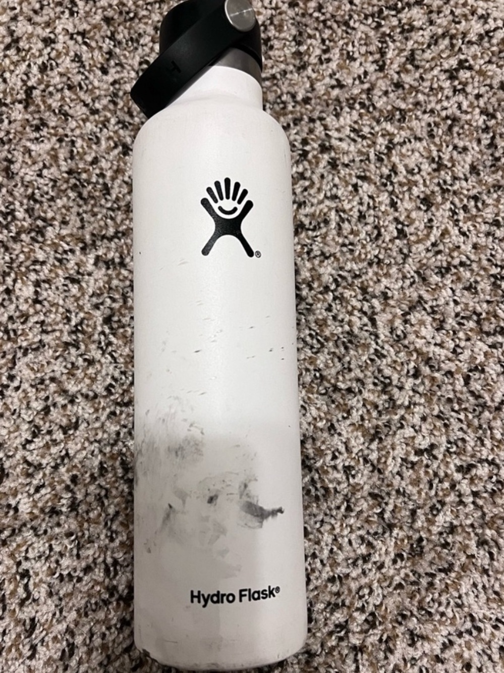 White 24 oz hydro flask with supreme sticker